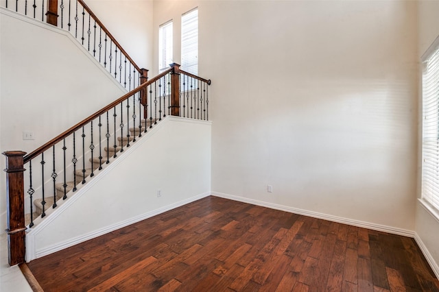 1531 Winding Trail Dr, Allen, TX 75002 - stairway with wood finished floors, baseboards, plenty of natural light, and a towering ceiling