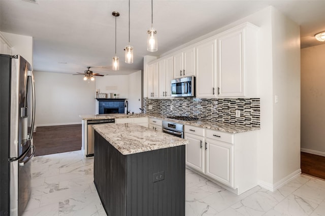 1531 Winding Trail Dr, Allen, TX 75002 - kitchen featuring stainless steel appliances, light marble finish floors, and a peninsula