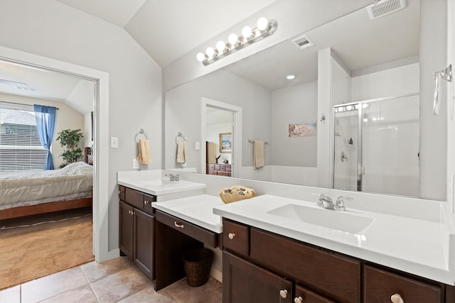616 Forefront Ave, Celina, TX 75009 - ensuite bathroom featuring vanity, tile patterned flooring, lofted ceiling, and a stall shower