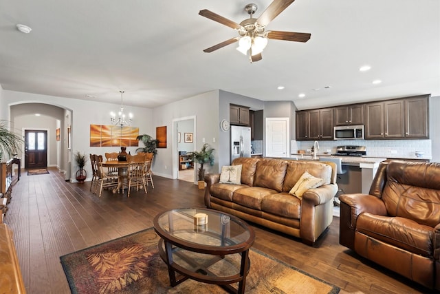 616 Forefront Ave, Celina, TX 75009 - living room featuring arched walkways, ceiling fan, a chandelier, dark wood-style flooring, and recessed lighting