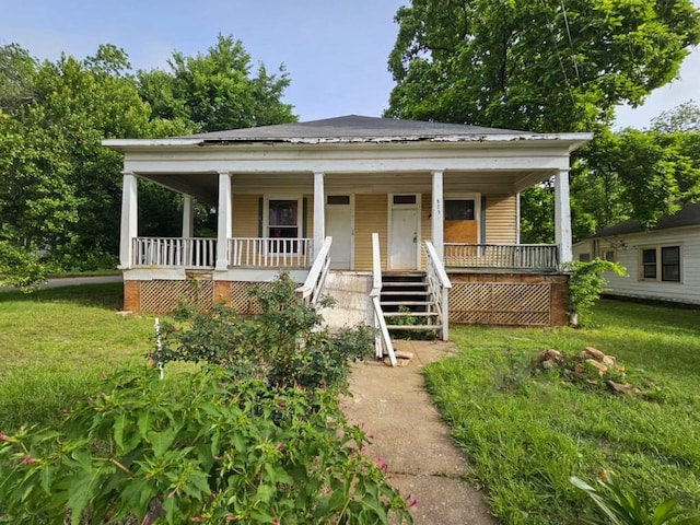 823 W Louisiana St, Palestine, TX 75801 - view of front of home with covered porch, a front yard, and stairway