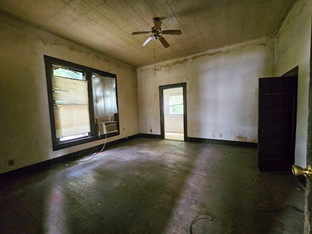 823 W Louisiana St, Palestine, TX 75801 - unfurnished room featuring a ceiling fan, hardwood / wood-style flooring, cooling unit, and baseboards