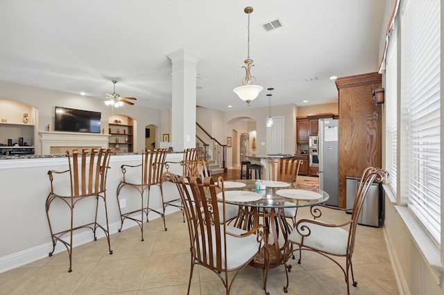 9352 Blanco Dr, Lantana, TX 76226 - dining room featuring arched walkways, ceiling fan, light tile patterned flooring, recessed lighting, and baseboards