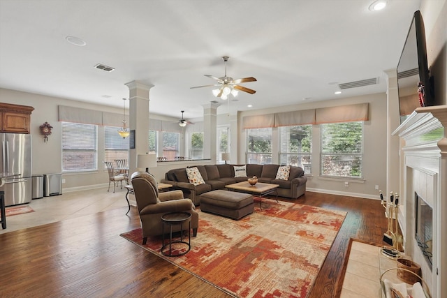 9352 Blanco Dr, Lantana, TX 76226 - living area featuring a ceiling fan, a fireplace with flush hearth, baseboards, light wood-style flooring, and recessed lighting