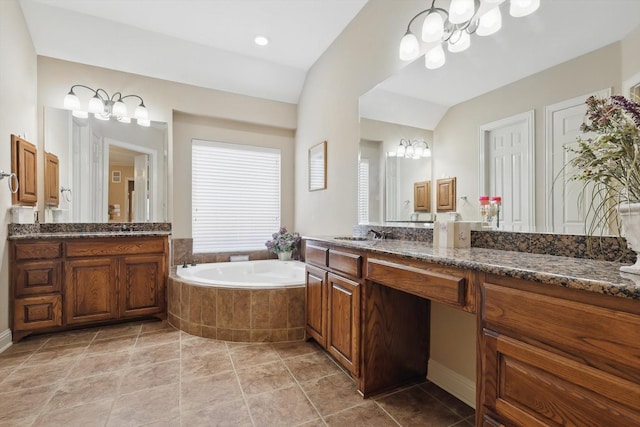 9352 Blanco Dr, Lantana, TX 76226 - full bathroom featuring a chandelier, healthy amount of natural light, a bath, vanity, and lofted ceiling