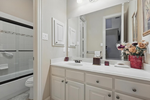 9352 Blanco Dr, Lantana, TX 76226 - bathroom featuring vanity, toilet, and shower / bath combination with glass door