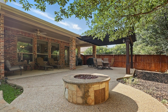 9352 Blanco Dr, Lantana, TX 76226 - fenced backyard with a patio, a ceiling fan, outdoor dining area, and an outdoor fire pit