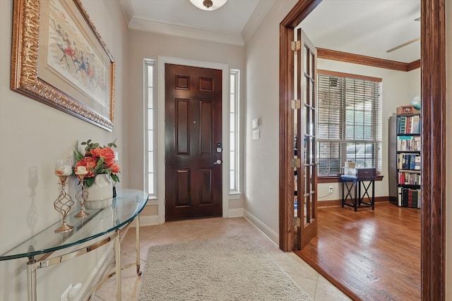9352 Blanco Dr, Lantana, TX 76226 - foyer entrance with plenty of natural light, light tile patterned floors, ornamental molding, and baseboards