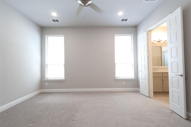 12978 Caprock Dr, Frisco, TX 75035 - unfurnished bedroom with light carpet, multiple windows, baseboards, and recessed lighting