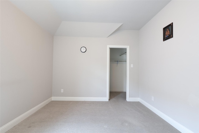 12978 Caprock Dr, Frisco, TX 75035 - unfurnished bedroom featuring light carpet, baseboards, a spacious closet, and a closet