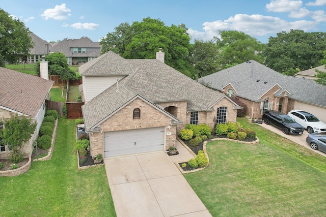 921 Stoneway Dr, Denton, TX 76210 - view of front facade featuring brick siding, a shingled roof, a chimney, a garage, and driveway
