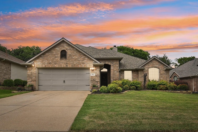 921 Stoneway Dr, Denton, TX 76210 - view of front of home with driveway, a garage, a front lawn, a shingled roof, and a chimney