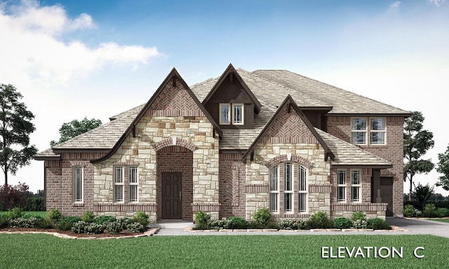 2404 Rockwood Ln, Mansfield, TX 76063 - view of front of home with stone siding and a front yard