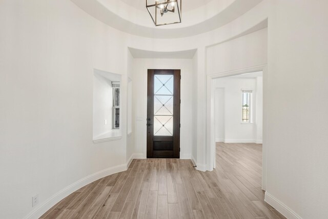 2404 Rockwood Ln, Mansfield, TX 76063 - dining space featuring light wood finished floors, stairway, baseboards, and a high ceiling