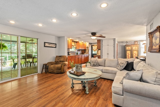 6171 Inca Dr, Mabank, TX 75156 - living area with a textured ceiling, light wood-style flooring, a ceiling fan, and recessed lighting