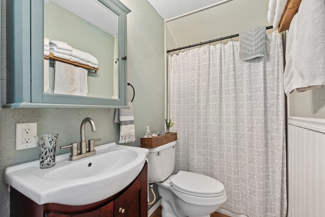 6171 Inca Dr, Mabank, TX 75156 - full bathroom with vanity, toilet, a textured wall, and a shower with shower curtain