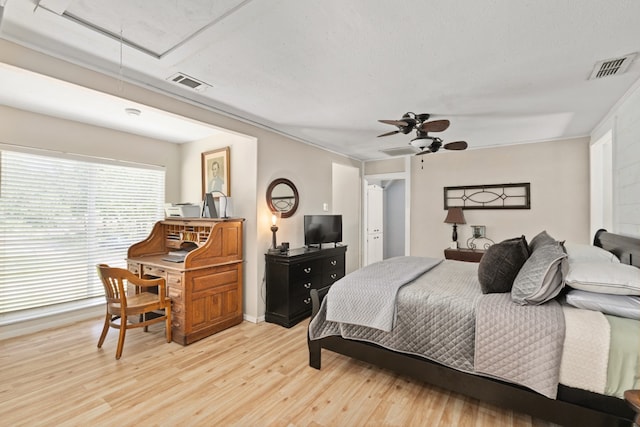 6171 Inca Dr, Mabank, TX 75156 - bedroom featuring attic access, light wood-style flooring, ceiling fan, and baseboards