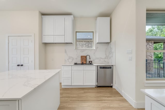 821 Hearthside Way, Mckinney, TX 75071 - kitchen with dishwasher, a sink, light wood-type flooring, and white cabinetry