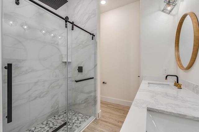 821 Hearthside Way, Mckinney, TX 75071 - full bath featuring a shower stall, double vanity, wood finished floors, and baseboards