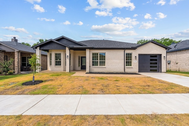 821 Hearthside Way, Mckinney, TX 75071 - view of front of home featuring driveway, an attached garage, a front lawn, and brick siding