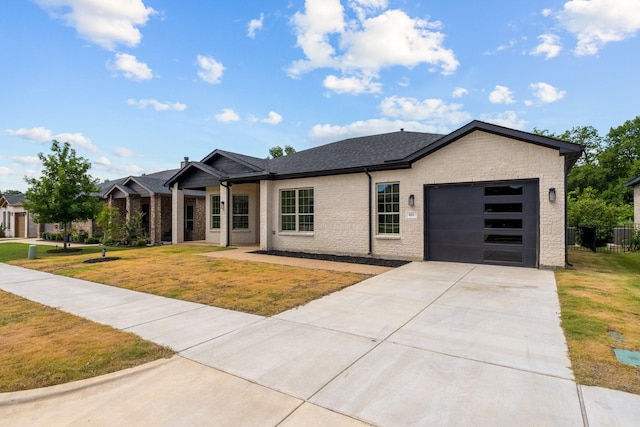 821 Hearthside Way, Mckinney, TX 75071 - view of front facade featuring a garage, concrete driveway, a front lawn, and brick siding