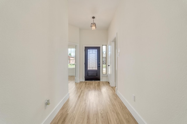 821 Hearthside Way, Mckinney, TX 75071 - entrance foyer with light wood finished floors and baseboards