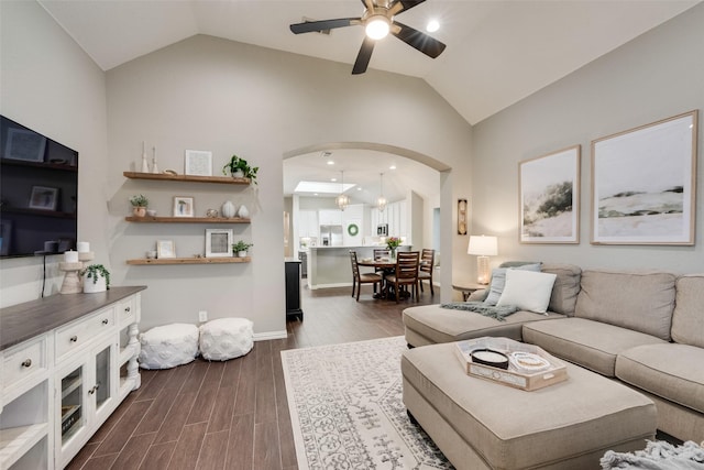 5536 Green Hollow Ln, The Colony, TX 75056 - living room with ceiling fan, arched walkways, dark wood finished floors, and high vaulted ceiling