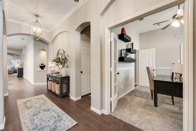 5536 Green Hollow Ln, The Colony, TX 75056 - hallway featuring arched walkways, ornamental molding, baseboards, wood tiled floors, and a chandelier