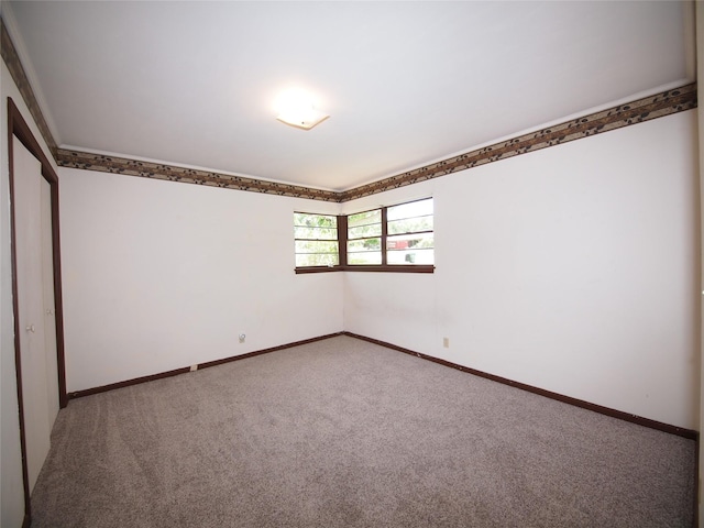 1431 Brazos St, Graham, TX 76450 - carpeted spare room with baseboards