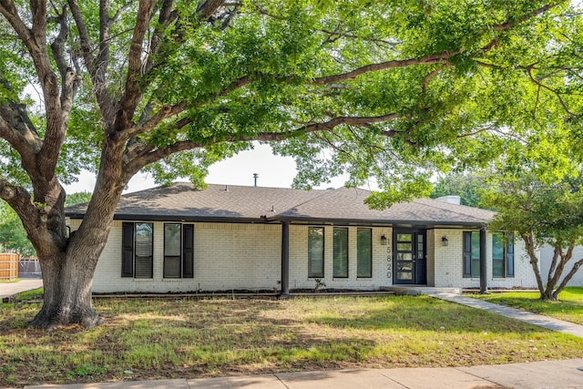 15820 Meadow Vista Dr, Dallas, TX 75248 - view of front of home featuring brick siding, a front yard, and roof with shingles