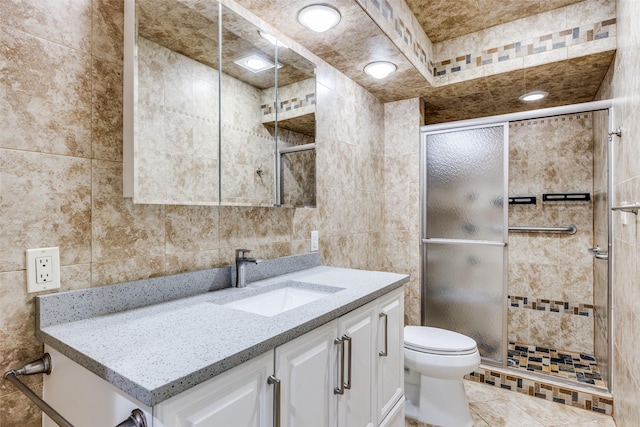 15820 Meadow Vista Dr, Dallas, TX 75248 - bathroom featuring tile walls, vanity, a shower stall, toilet, and tile patterned floors