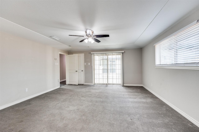 15820 Meadow Vista Dr, Dallas, TX 75248 - carpeted empty room with a ceiling fan, plenty of natural light, and baseboards