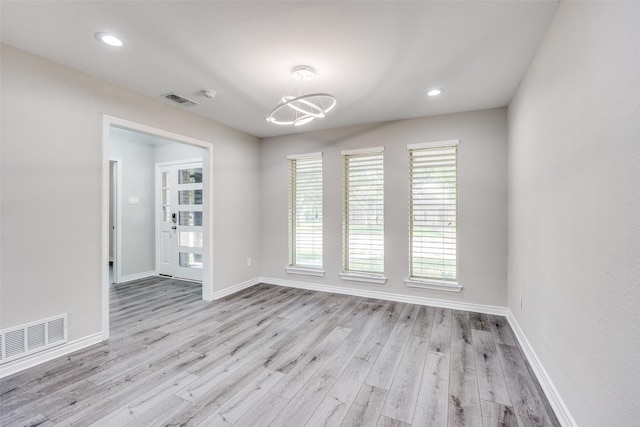 15820 Meadow Vista Dr, Dallas, TX 75248 - spare room featuring plenty of natural light, baseboards, wood finished floors, recessed lighting, and a chandelier