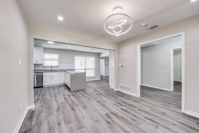 15820 Meadow Vista Dr, Dallas, TX 75248 - kitchen with stainless steel dishwasher, light wood-type flooring, white cabinets, and recessed lighting