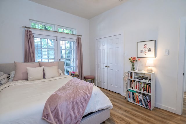 3311 Blackburn St Unit 115, Dallas, TX 75204 - bedroom with wood finished floors, a closet, and baseboards