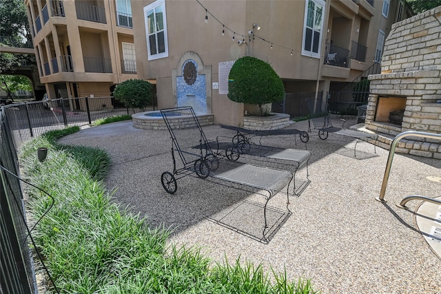 3311 Blackburn St Unit 115, Dallas, TX 75204 - view of patio / terrace with an outdoor brick fireplace
