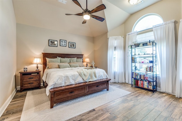 1386 Caspian Dr, Roanoke, TX 76262 - bedroom featuring wood finished floors, lofted ceiling, baseboards, and ceiling fan