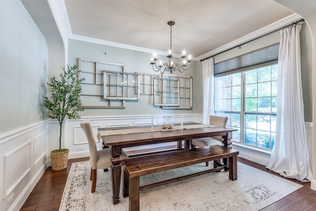 1386 Caspian Dr, Roanoke, TX 76262 - dining area featuring crown molding, a chandelier, dark wood-style floors, wainscoting, and a decorative wall