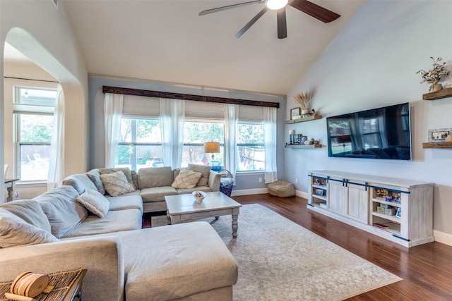 1386 Caspian Dr, Roanoke, TX 76262 - living room with ceiling fan, baseboards, high vaulted ceiling, dark wood-style flooring, and arched walkways