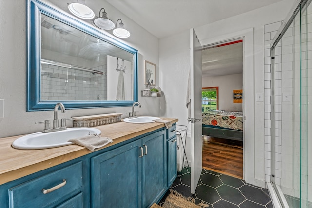 40248 Fm 2481, Hico, TX 76457 - bathroom with ensuite bath, a shower stall, double vanity, and tile patterned floors