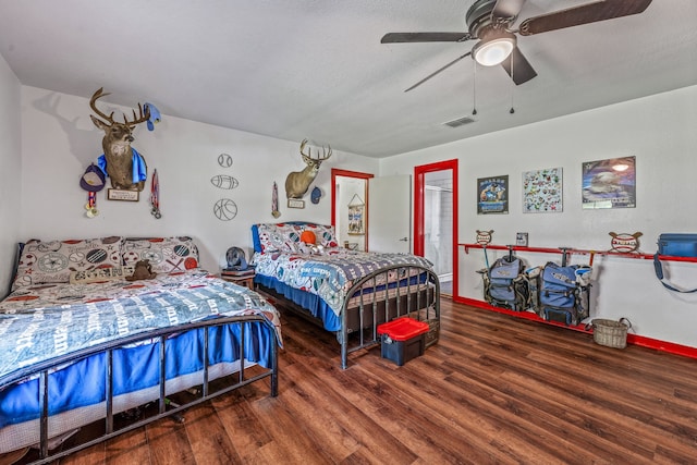 40248 Fm 2481, Hico, TX 76457 - bedroom with wood finished floors, baseboards, and a ceiling fan