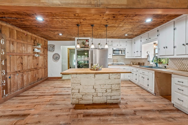 40248 Fm 2481, Hico, TX 76457 - kitchen with a sink, appliances with stainless steel finishes, wooden counters, white cabinets, and wooden ceiling