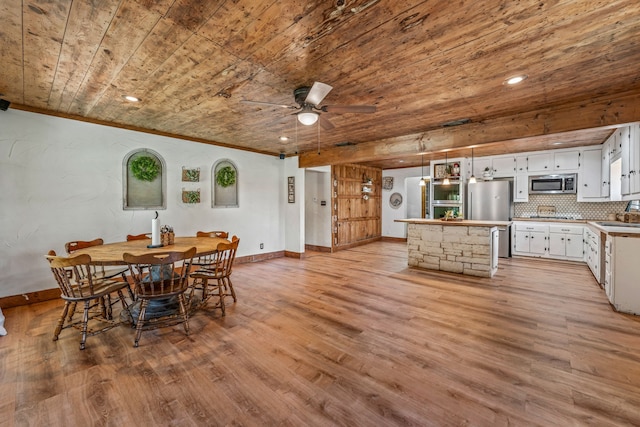 40248 Fm 2481, Hico, TX 76457 - dining room with wood ceiling, baseboards, light wood finished floors, ornamental molding, and a ceiling fan