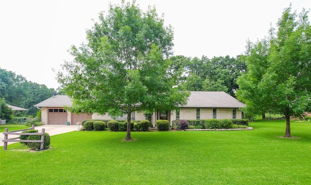 107 Clover Dr, Gun Barrel City, TX 75156 - obstructed view of property with a front yard, a garage, driveway, and brick siding