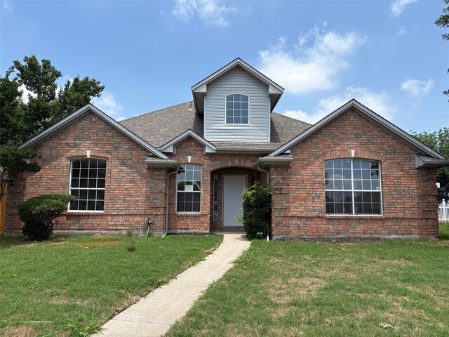 5421 Palace Dr, Richardson, TX 75082 - traditional home with brick siding and roof with shingles