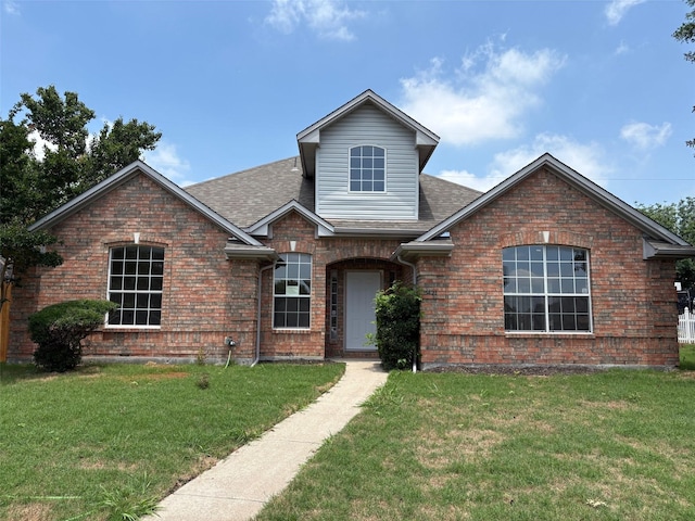 5421 Palace Dr, Richardson, TX 75082 - traditional-style house with a front yard, brick siding, and a shingled roof