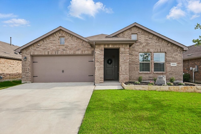 3800 Canyon Verde Ln, Denton, TX 76226 - view of front facade with concrete driveway, a front yard, an attached garage, and brick siding