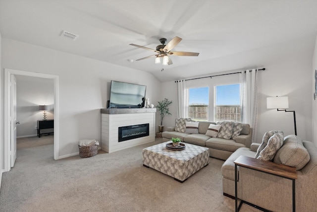 3800 Canyon Verde Ln, Denton, TX 76226 - carpeted living area featuring a ceiling fan, a glass covered fireplace, and baseboards
