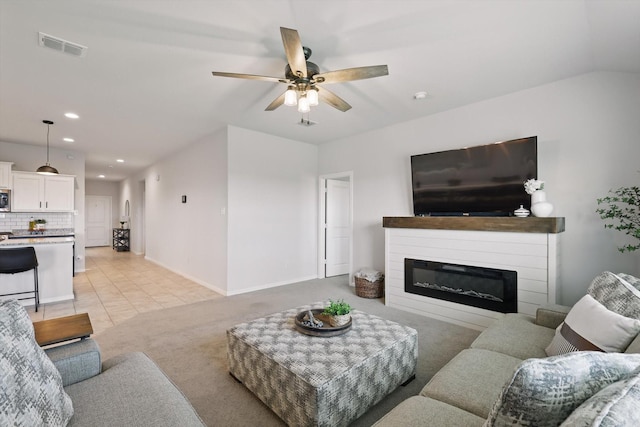 3800 Canyon Verde Ln, Denton, TX 76226 - living area with ceiling fan, a glass covered fireplace, recessed lighting, baseboards, and light colored carpet