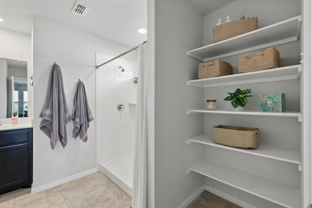 3800 Canyon Verde Ln, Denton, TX 76226 - full bathroom featuring vanity, a tile shower, baseboards, and tile patterned floors